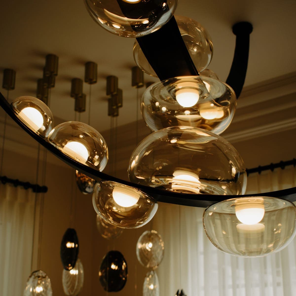 Warm glass pendant lamps glowing over the studio suite.